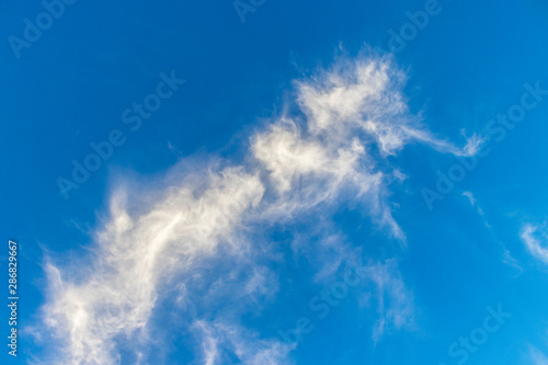 White clouds in the blue sky background in clearing day and good weather day