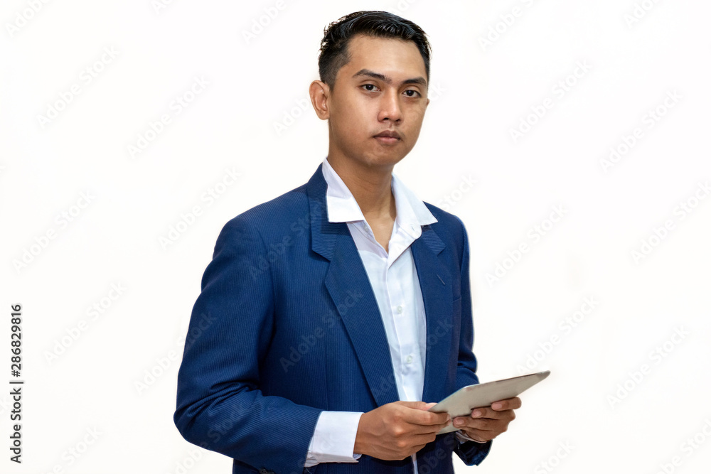 Portrait of a young asian businessman using tablet computer