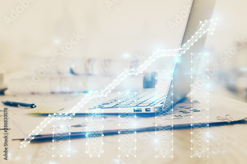 Forex Chart hologram on table with computer background. Multi exposure. Concept of financial markets.