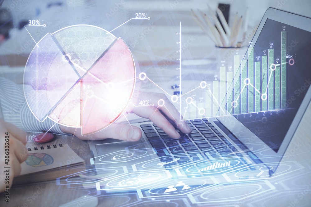 Multi exposure of stock market graph with man working on laptop on background. Concept of financial analysis. Multi exposure of stock market graph with man working on laptop on background. Concept of financial analysis.