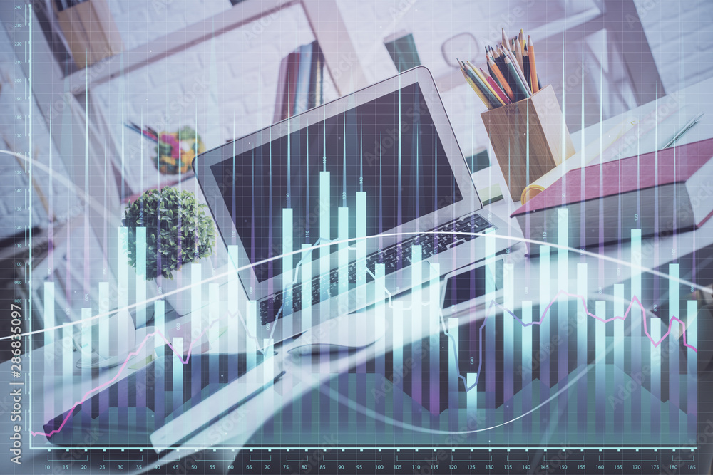 Forex market graph hologram and personal computer on background. Multi exposure. Concept of investment. Forex market graph hologram and personal computer on background. Multi exposure. Concept of investment.