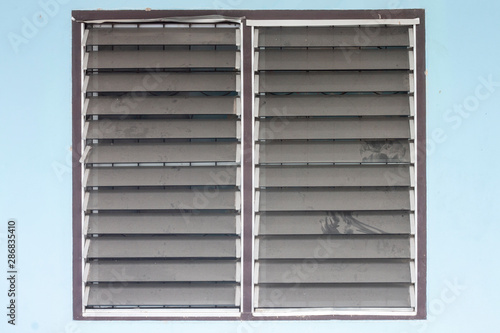 Dust clinging on a louver window that have never been cleaned affecting the health of residents.