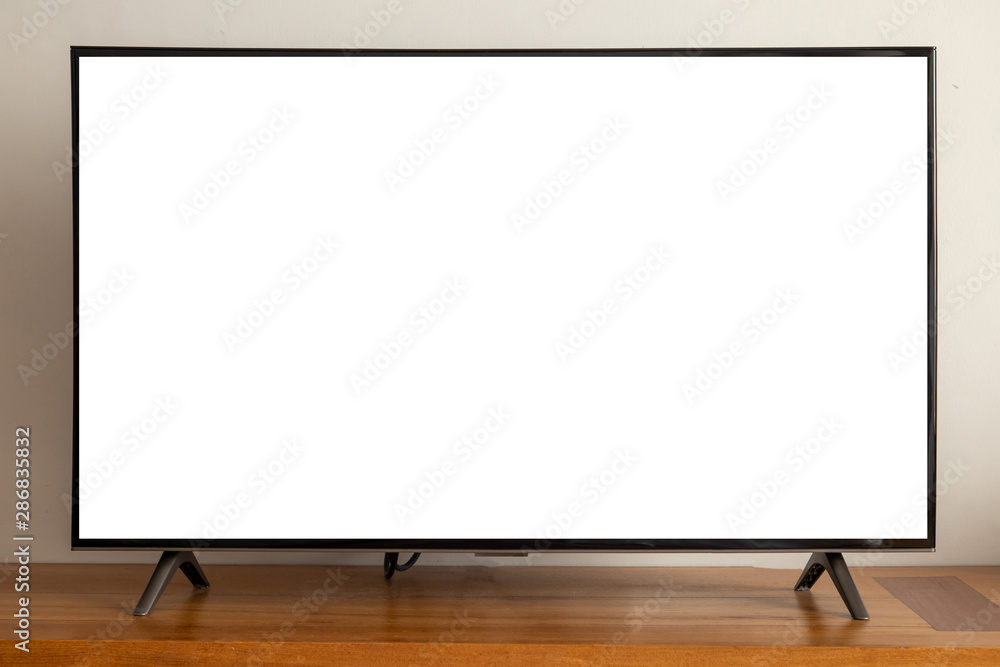 Fototapeta premium blank screen led television on wood table.