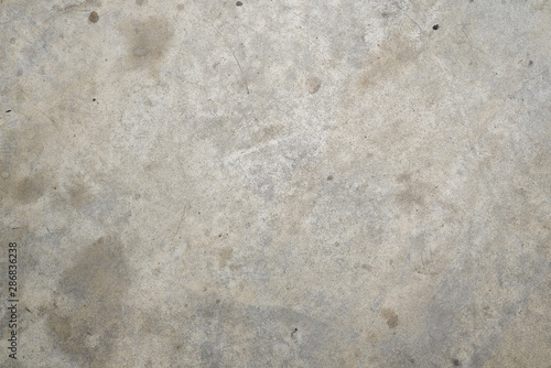 Gray concrete floor with oil stains.Background.