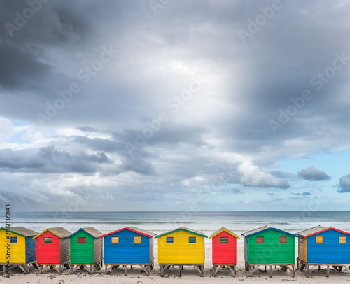 Multicolored cabins in a row on the beach at Muizenberg- South Africa © Chris