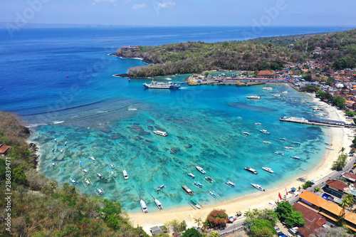 Beautiful drone view of Padang Bai harbour and resorts, East Bali.