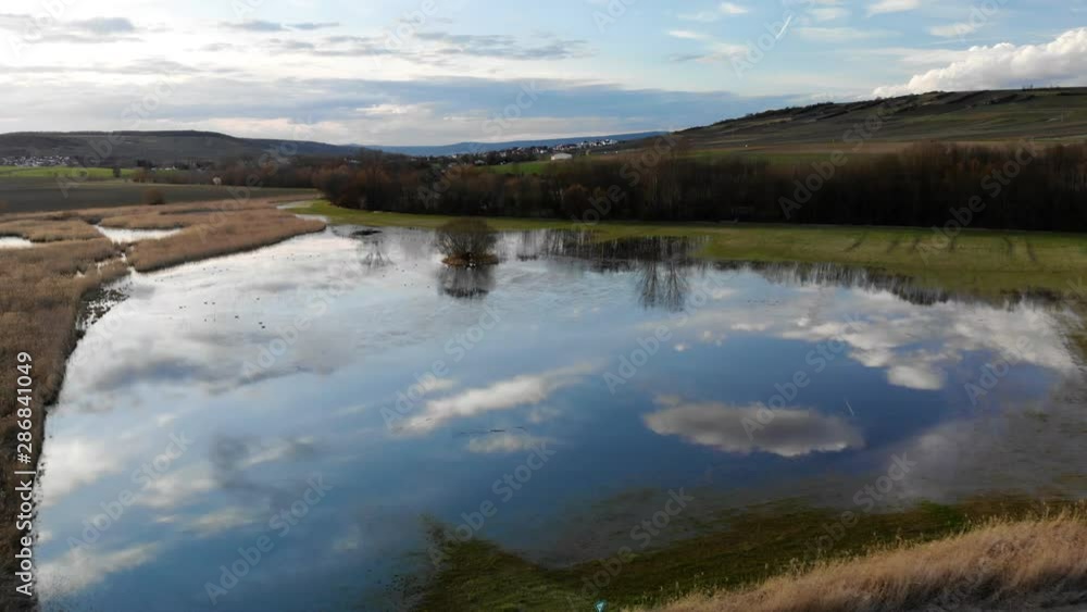 Pond Reflecting White Clouds and Blue Sky Pond Reflecting White Clouds and Blue Sky