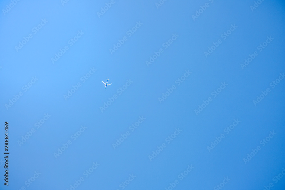 Paraglider floating through a blue sky over Camps Bay, Cape Town. Paraglider floating through a blue sky over Camps Bay, Cape Town.
