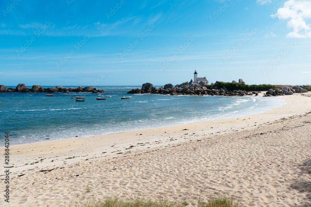 Scenic view of beach and lighthouse in Brittany