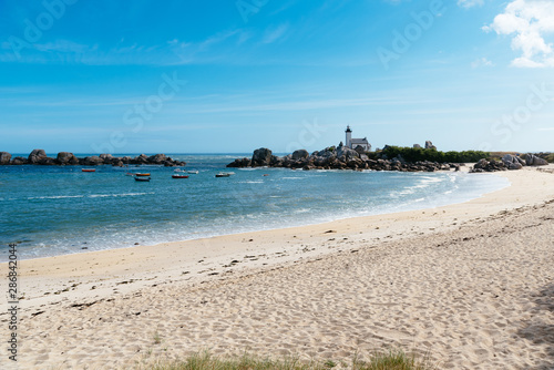 Scenic view of beach and lighthouse in Brittany