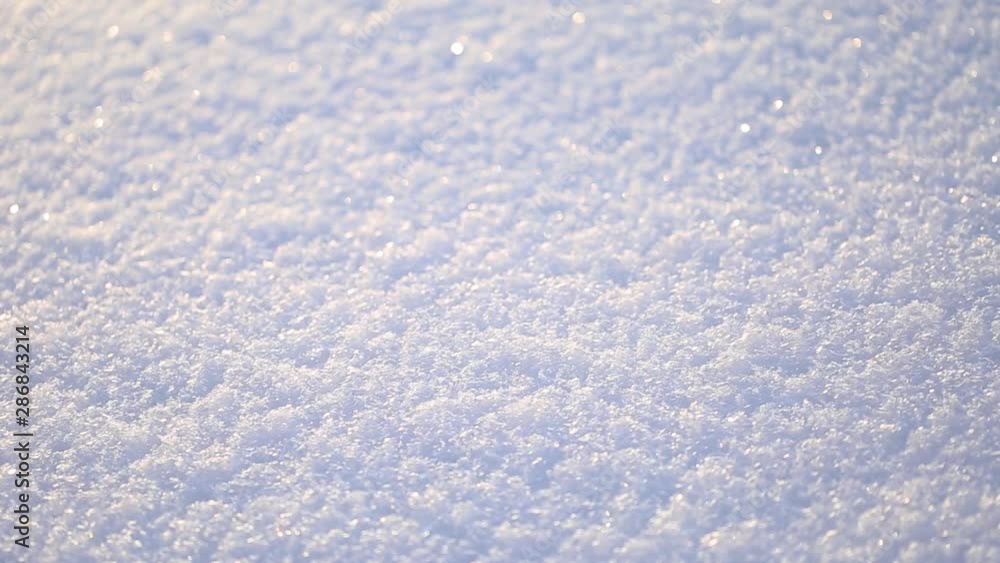 Closeup view of fresh soft snow laying on frozen ground outdoor on sunny winter day. Real time full hd video footage. Closeup view of fresh soft snow laying on frozen ground outdoor on sunny winter day. Real time full hd video footage.