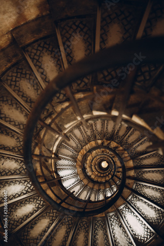 Spiral staircase and human hand