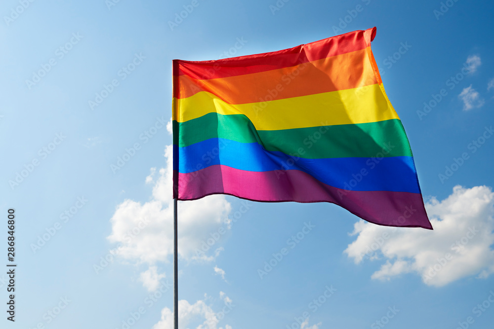 Waving rainbow flag in the sky Waving rainbow flag in the sky