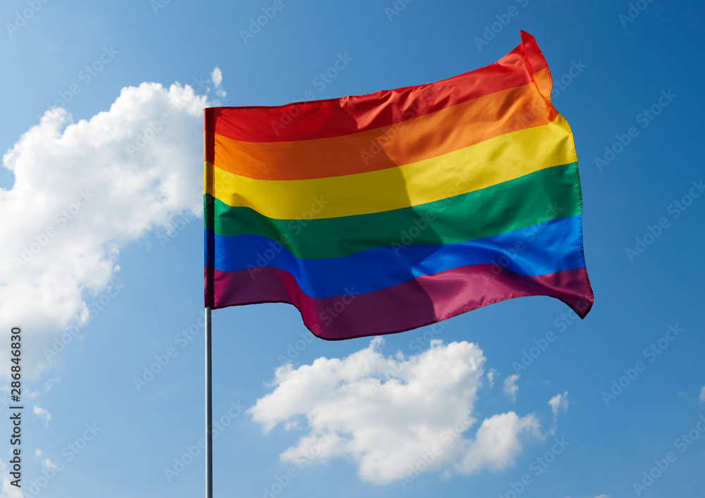 Close up of rainbow flag waving outside Close up of rainbow flag waving outside