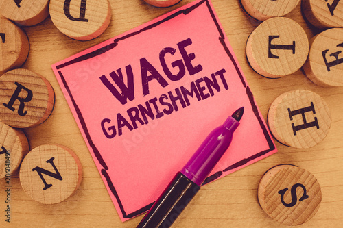 Photos Writing note showing Wage Garnishment