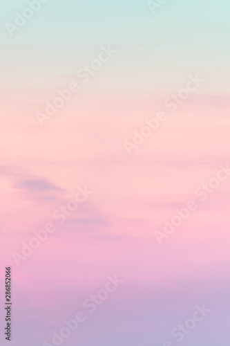 Vertical ratio size of sunset background. sky with soft and blur pastel colored clouds. gradient cloud on the beach resort. nature. sunrise.  peaceful morning. Instagram toned style photo