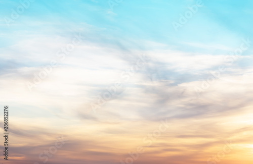 sunset background. sky with soft and blur pastel colored clouds.  gradient cloud on the beach resort. nature. sunrise.  peaceful morning. Instagram toned style © flowertiare