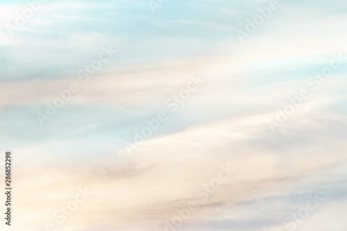 sunset background. sky with soft and blur pastel colored clouds.  gradient cloud on the beach resort. nature. sunrise.  peaceful morning. Instagram toned style