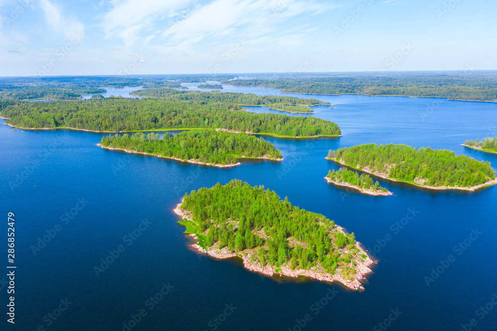 Aerial view of green islands and blue lake