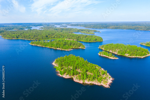 Aerial view of green islands and blue lake