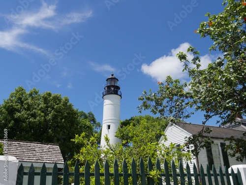Wide shot of the Key West lighthouse  and the keeper's quarters. The lighthouse is a historical attraction in Key West, Florida. © raksyBH