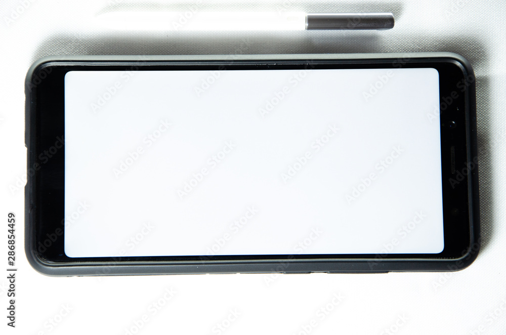 Electronic signature by a male hand on a smartphone with a black frame on a white background close, top, side Electronic signature by a male hand on a smartphone with a black frame on a white background close, top, side