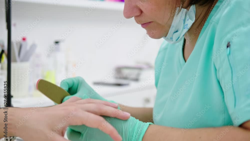 Woman having manicure at beauty salon Woman having manicure at beauty salon