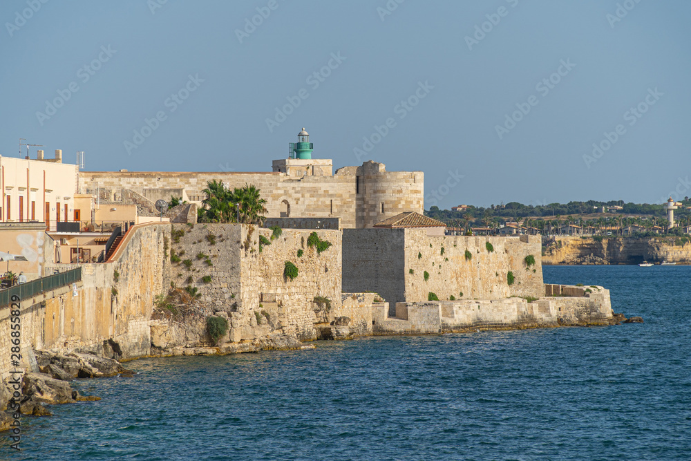 Syracuse, Sicily. Beautiful view of the Ionian Sea coastline in Ortigia, Italy Syracuse, Sicily. Beautiful view of the Ionian Sea coastline in Ortigia, Italy