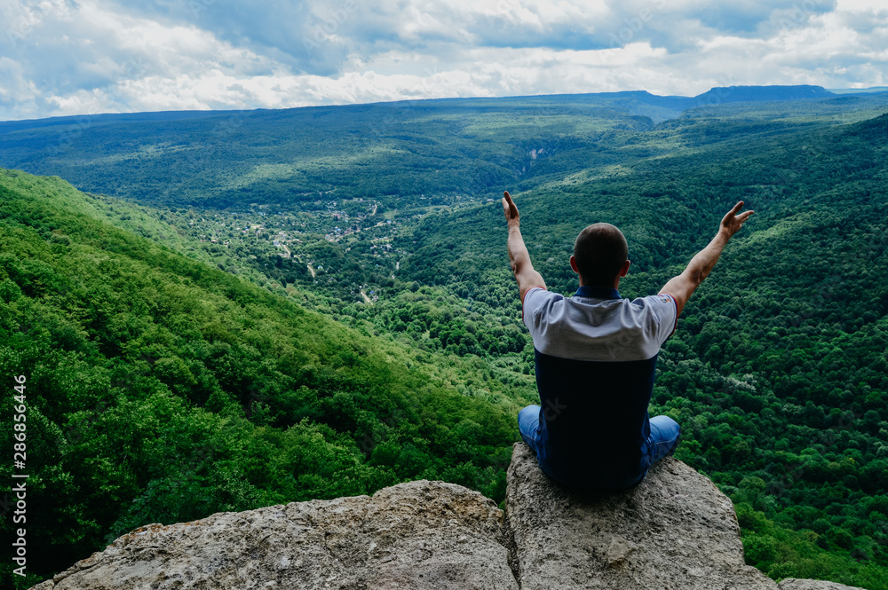 Obraz premium man on top of mountain