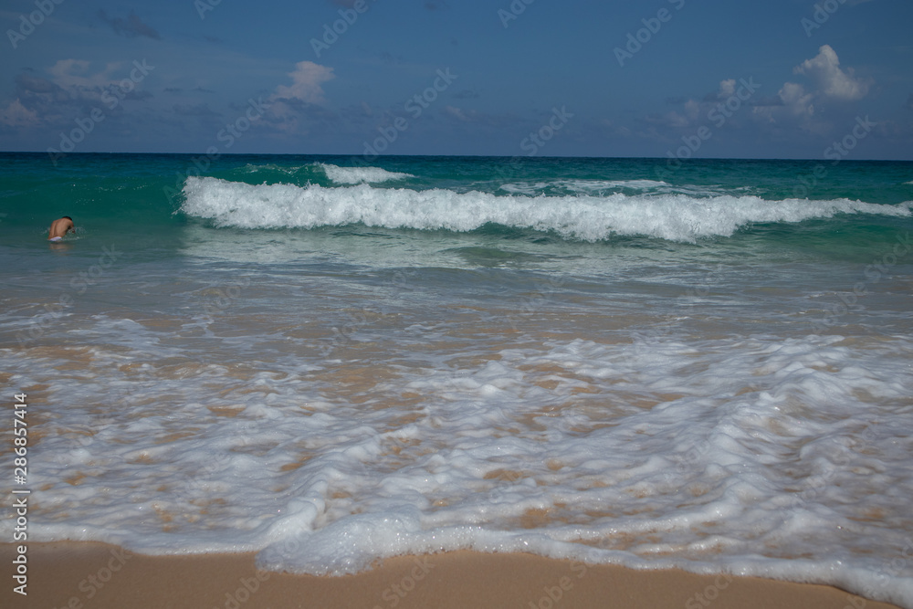 Blue sea clean white waves at Karon Beach