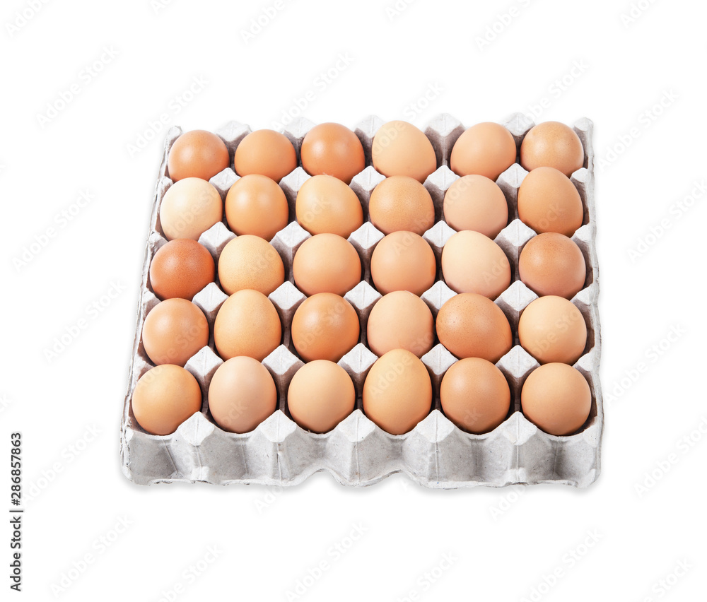 Chicken eggs in carton box isolated on white.