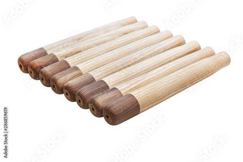 Furniture legs from solid ash and walnut on a white background. Kids furniture. Furniture details