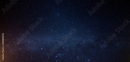 View of milky way galaxy with stars on a night sky background © anut21ng Stock