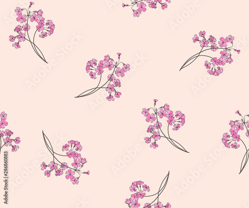 Floral seamless pattern for fabric. Bouquets of primroses on a beige background.