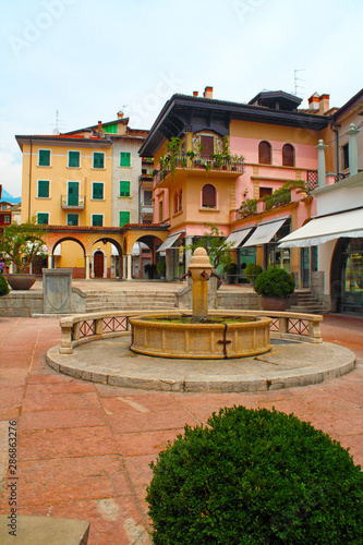  Riva del Garda  Italy - historic street with fountain and houses