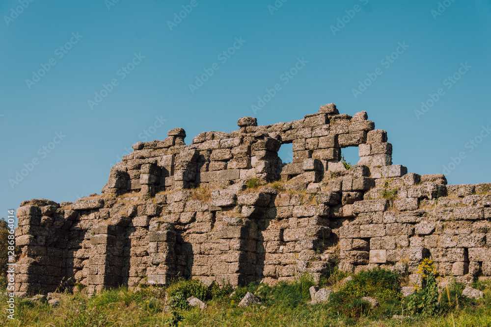 Old aqueduct in Side. Ruins of the ancient city of Turkey. Antalya coast.Antalya Province. Pamphylia. Ancient building. Historical place