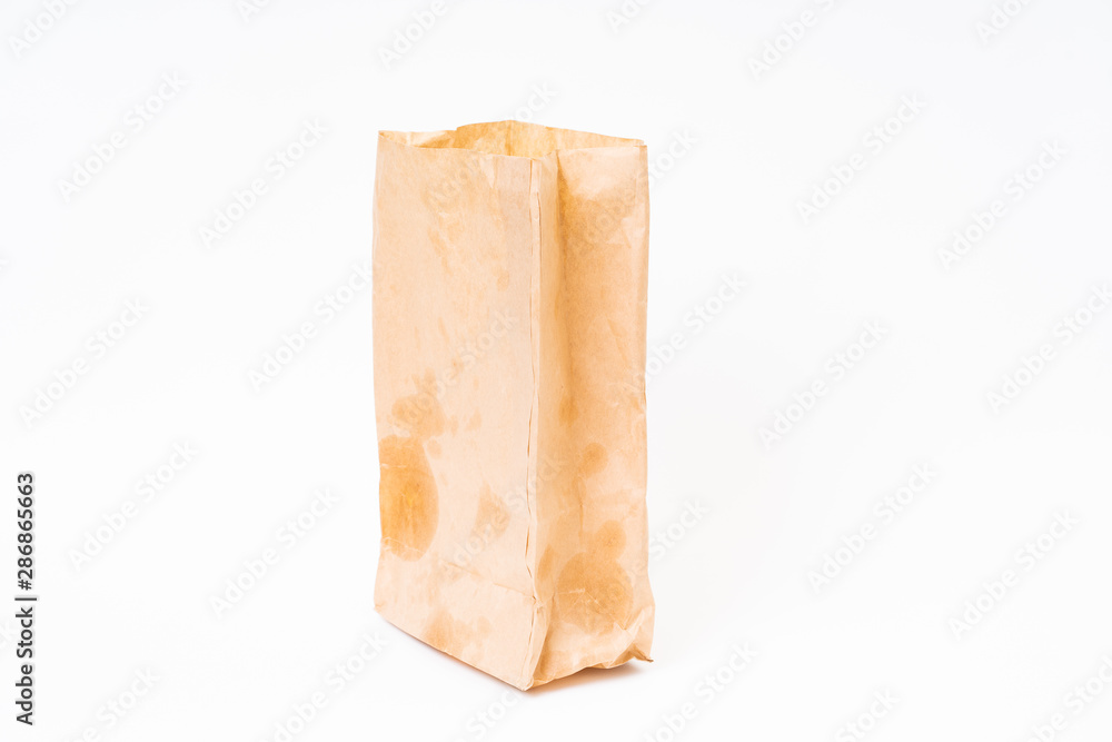 Crumpled brown paper bag on white background Crumpled brown paper bag on white background
