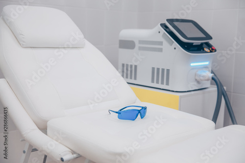 Medical equipment for cosmetology, laser epilation machine, beauty couch. Beautician cabinet, beauty salon interior details © Алина Троева