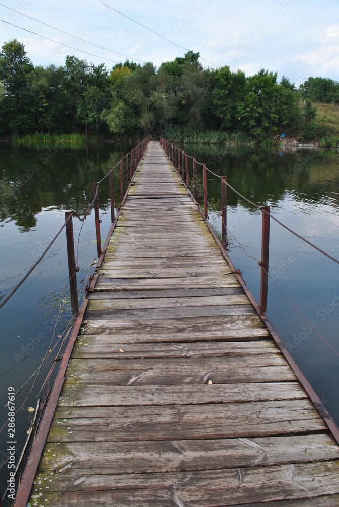 wooden bridge on lake