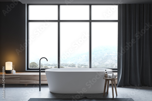 Dark gray bathroom  tub and window