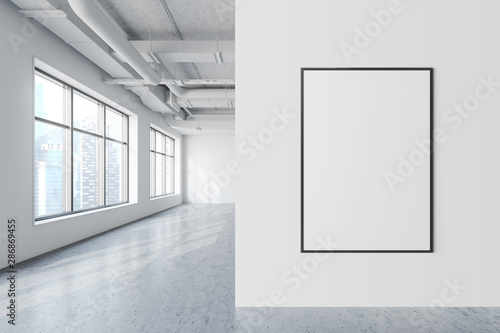 Mock up poster in white industrial style office