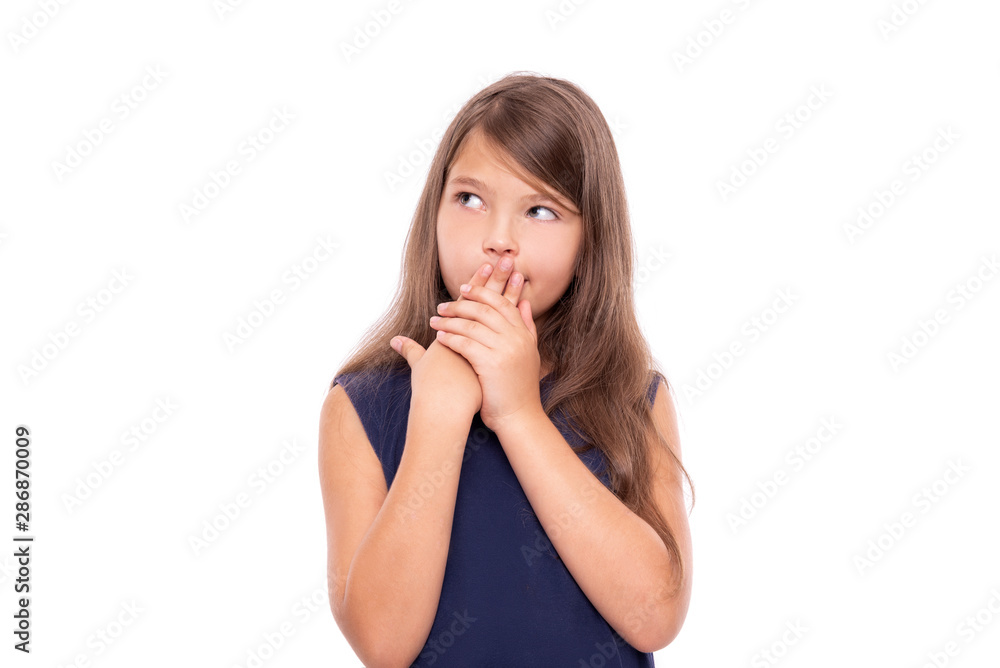 Pensive little girl thinks about something. Isolated on a white background. Pensive little girl thinks about something. Isolated on a white background.