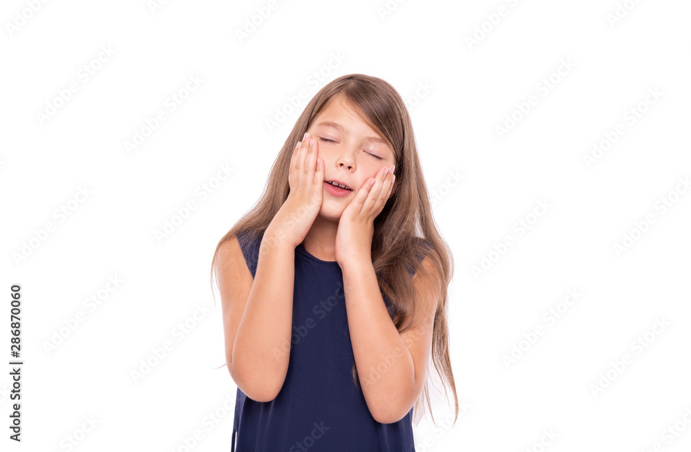 Little girl dreams closing her eyes isolated on a white background. Little girl dreams closing her eyes isolated on a white background.