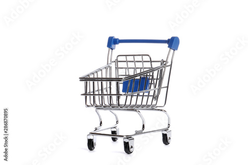 Empty metal shopping trolley isolated on white