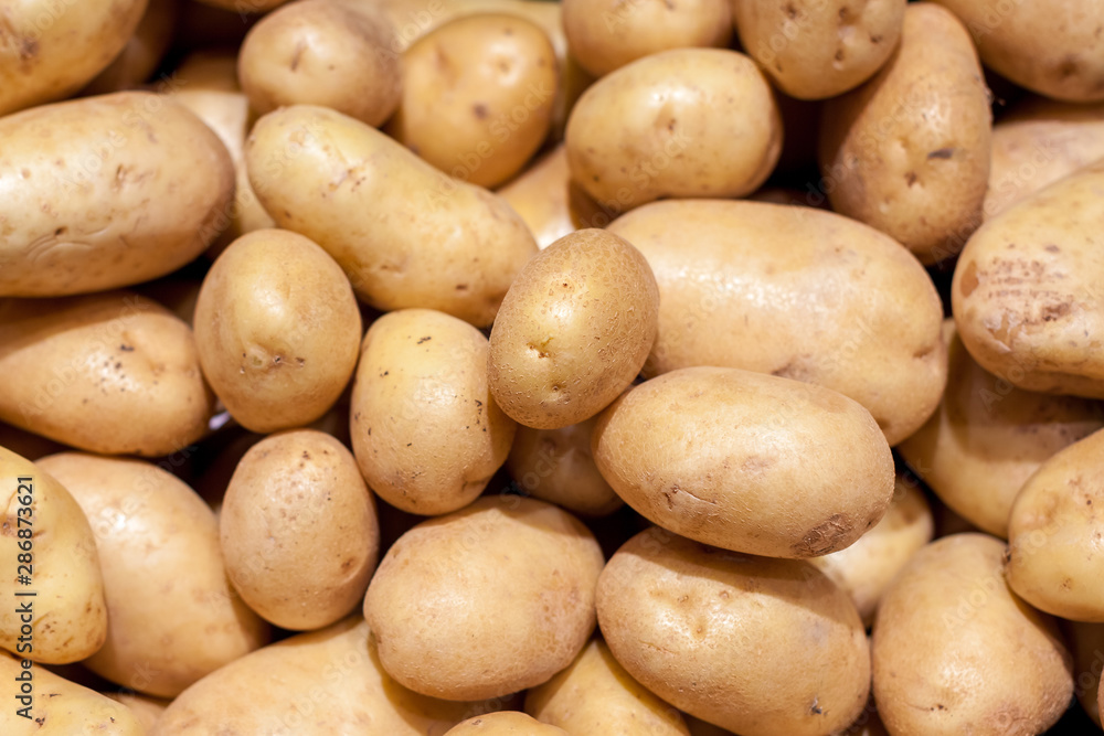 Fresh organic young potatoes sold on market. Food. Fresh organic young potatoes sold on market. Food.