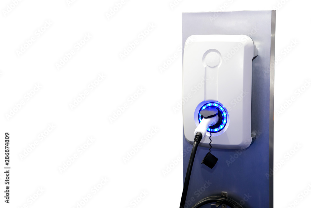 Power supply for electric car charging. Electric car charging station. Close up of the power supply plugged into an electric car being charged Power supply for electric car charging. Electric car charging station. Close up of the power supply plugged into an electric car being charged