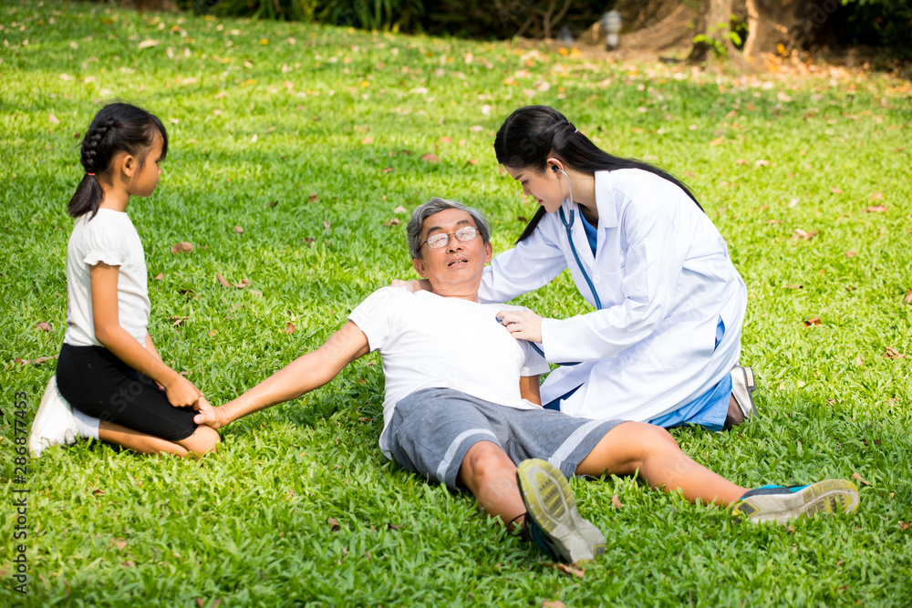 Female Medical examination elderly man Lie in the hospital garden Female Medical examination elderly man Lie in the hospital garden