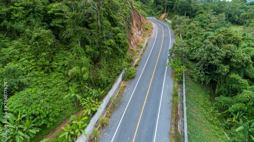 Asphalt road curve in high mountain image by Drone