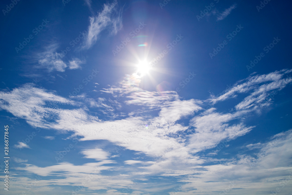 Shining sun blue sky with lens flare Shining sun blue sky with lens flare