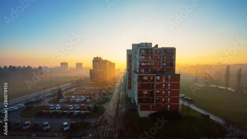 Time Lapse of beautiful sunrise over the city with backlit haze around the buildings, Karlovac, Croatia.